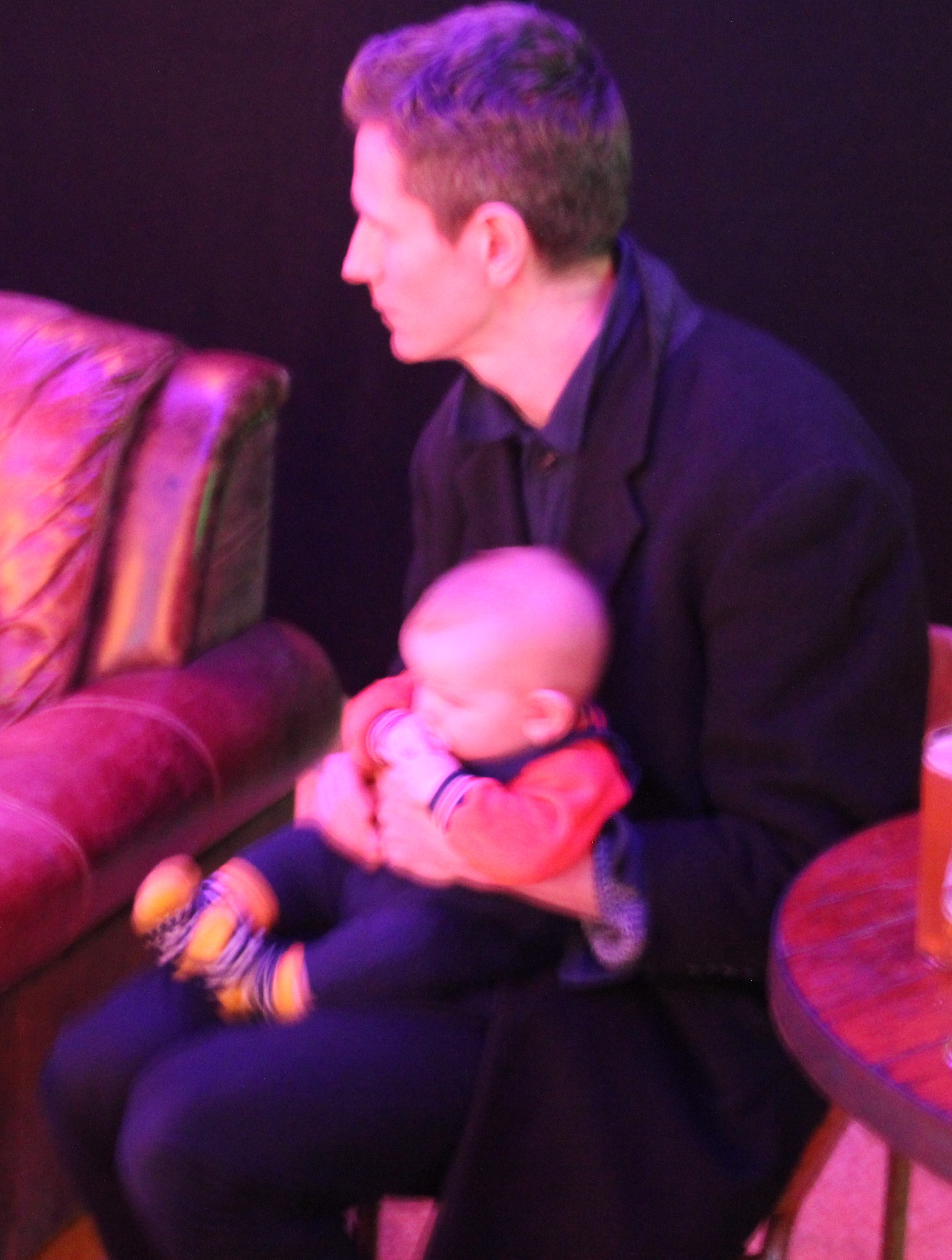 Tom with a baby